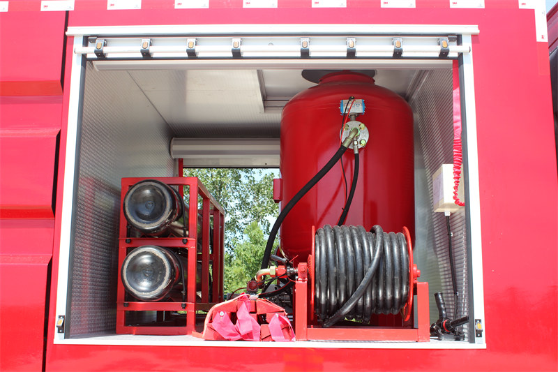 Dry powder system with jetting hose reel